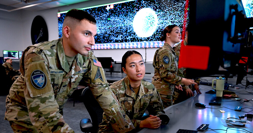 Spacemen looking at a screen